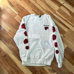 White crew neck sweatshirt with embroidered roses and words